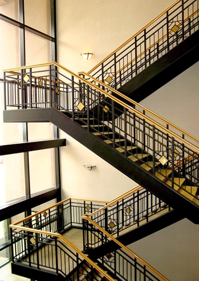 Multi-level steel staircase and ornamental railings fabricated by DYCO Industries