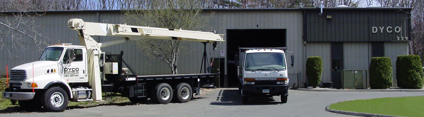 DYCO Industries facility and work trucks at 229 South Satellite Road